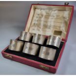 Cased set of six engine turned napkin rings with various hallmarks across the years, Sheffield,