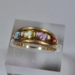 9ct gold four stone multi coloured dress ring. 2.8g approx. Size K1/2. (B.P. 21% + VAT)