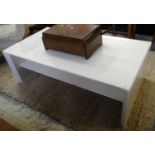 Modern designer white finished coffee table of rectangular form with undershelf. 122cm wide