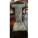 Victorian walnut upholstered prie dieu chair on scroll legs and casters. (B.P. 21% + VAT)