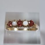 9ct gold red stone and opal dress ring. 3.1g approx. Size Q. (B.P. 21% + VAT)