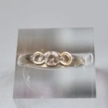 9ct white gold three stone dress ring. 2.2g approx. Size N. (B.P. 21% + VAT)