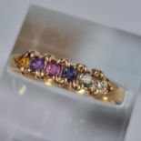 9ct gold multi coloured six stone dress ring. 2.3g approx. Size P. (B.P. 21% + VAT)