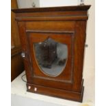 Early 20th century oak shield shaped mirror design single door wall cabinet. (B.P. 21% + VAT)