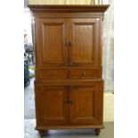 Victorian scumbled pine press cupboard, the moulded cornice above two blind panelled doors, the