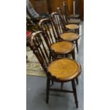Set of four late 19th early 20th century aesthetic design spindle back dining chairs on circular