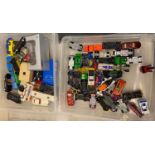 Two plastic boxes of assorted Hot Wheels and other play worn diecast model vehicles, together with a