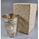 Box containing a silver conical drinking glass with engraved decoration to the top. 1.4 troy oz