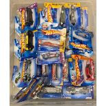 Plastic box of assorted Hot Wheels diecast model vehicles, all i8n original boxes, approximately 25.