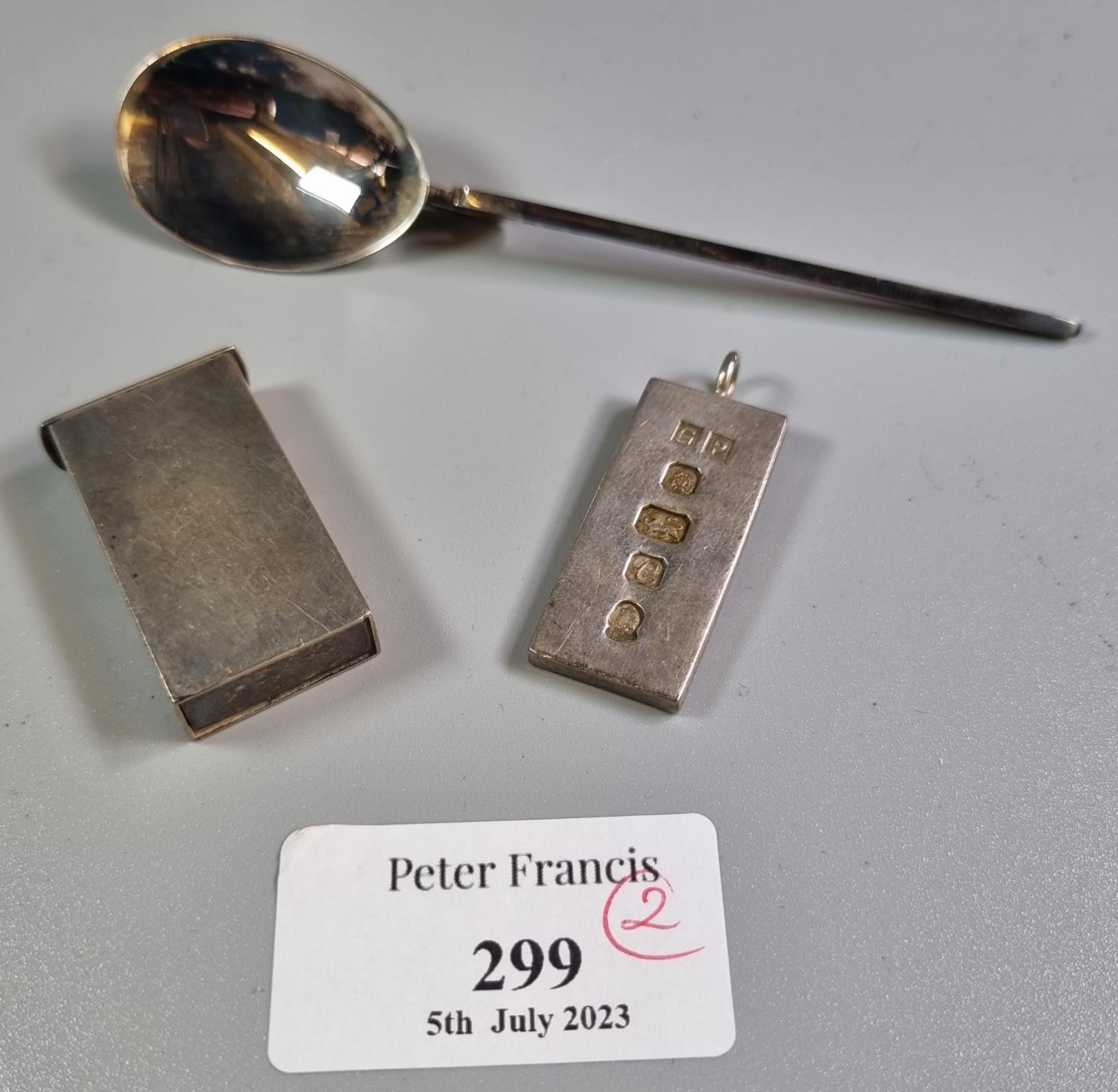 Reproduction cased silver design of a roman spoon together with a silver hallmarked ingot pendant