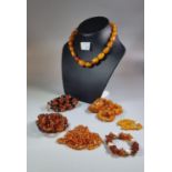 Bag comprising assorted amber necklaces, varying designs. (B.P. 21% + VAT)