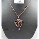 Edwardian design yellow metal chain with Art Nouveau purple and white stone pendant. (B.P. 21% +