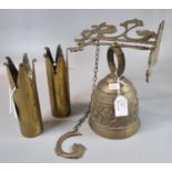 Pair of brass trench art shell cases, now decorated as vases, together with a brass bell. (B.P.