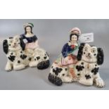 Pair of 19th Century Staffordshire figures sitting on large Spaniel dogs. (2) (B.P. 21% + VAT)