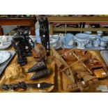 Two trays of carved wooden ethnographic items to include; Asian and African wall masks, wooden