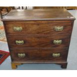 19th century mahogany straight front chest of three drawers on projecting base and bracket feet.