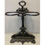 Victorian cast iron three section stick stand with handhole and moulded relief decoration of berries