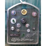 Pre War Alfa Romeo chrome radiator grill set with a variety of assorted Alfa Romeo badges and