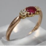 18ct gold Edwardian design ruby and diamond three stone ring. Ring size P & 1/2. 2.5g approx. (B.