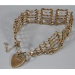 9ct gold gate bracelet with heart padlock. 11.9g approx. (B.P. 21% + VAT)