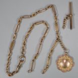 9ct gold gentleman's pocket watch chain with detached T bar and a 9ct gold fob marked 'Winners