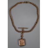 9ct gold curb link T bar pocket watch chain with engraved octagonal locket. 44g approx. (B.P.