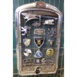 Pre War Peugeot chrome radiator grill set with a number of Peugeot bonnet motifs and vehicle badges,