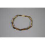 18ct gold 19 stone diamond and sapphire bracelet. 18.5cm long approx. (B.P. 21% + VAT)