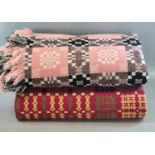 Two vintage woollen Welsh tapestry blankets or carthen; one pink ground with fringed edge and '