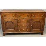 Early 19th century oak North Wales dresser base, the moulded top above an arrangement of five