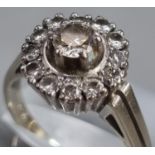 18ct white gold diamond cluster ring. 6.2g approx. Ring size N 1/2. (B.P. 21% + VAT)
