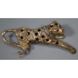 9ct gold leopard brooch decorated with naturalistic features, diamonds and rubies for eyes. 5cm long