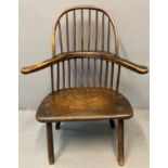 19th century ash and elm Welsh primitive stick backed elbow chair having beech spindles with a solid