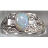 18ct white gold Art Deco style ring with central oval opal surrounded by baguette and other