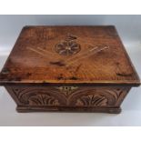 18th century oak box, of rectangular form, the hinged lid carved with lozenge panel and relief