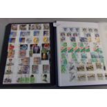 Collection of mostly Great Britain stamps in two stockbooks with value in mint commemorative sets,