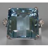 18ct white gold aquamarine ring, aqua marine stone 2x1.8cm approx., flanked by two small diamonds.