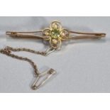 Edwardian 15ct gold Peridot and Seed Pearl brooch. 5.7cm long approx. 4.8g approx. (B.P. 21% + VAT)