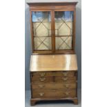 19th century mahogany inlaid two stage bureau bookcase, the moulded dental cornice above two