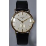 Longines gold gentleman's mechanical dress watch, having satin face with baton numerals and