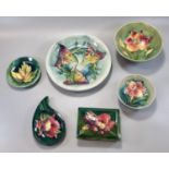 Collection of Moorcroft pottery tube lined items, to include: two 'Freesia' design bowls, 16 and