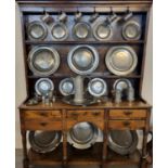 Collection of 18th/19th century pewter items to include: chargers, plates, pot bellied and other
