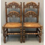 Pair of 17th century Yorkshire style oak hall/dining chairs, the rounded carved relief foliate backs