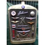 Pre War Hillman car radiator and grill, set with a collection of assorted Hillman vehicle badges.