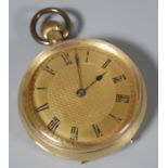 18ct gold open faced keyless fob watch with engine turned Roman face, 3.5cm diameter approx.
