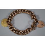 9ct gold gents curb-link bracelet with heart padlock and George III half guinea coin dated 1797.