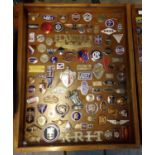A good glazed case of mainly American enamel and other vehicle badges, to include: Stutz 8,