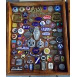 A good glazed case containing assorted French and other European motor car enamel badges, scripts