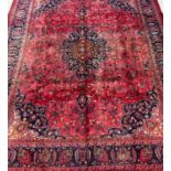 Large multi-coloured ground Persian Mashad floral and foliate carpet. 378 x 293cm approx. (B.P.