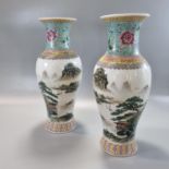 Pair of Chinese mirror matched porcelain Famille Rose baluster 'Landscape Vases', each depicting a
